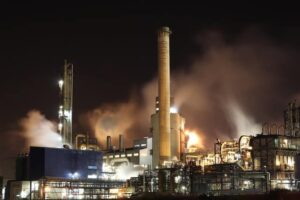 An industrial factory operating late at night